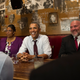 President Barack Obama speaks to the media after having lunch with formerly incarcerated individuals who have received commutations, including Ramona Brant (left) and Phillip Emmert (right), at Bus Boys and Poets restaurant in Washington, D.C., on March 30, 2016.
Kevin Dietsch-Pool/Getty Images